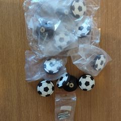 12 football shaped cabinet/drawer knobs, 4 used and 8 unused