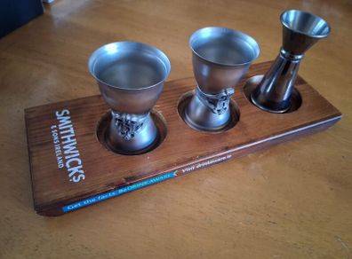 Smithwicks board with cocktail measures