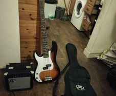 Left hand electric bass guitar and amp