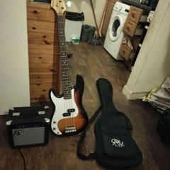 Left hand electric bass guitar and amp