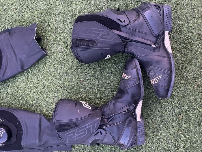 Motor cycle racing leathers with boots, gloves and helmet.