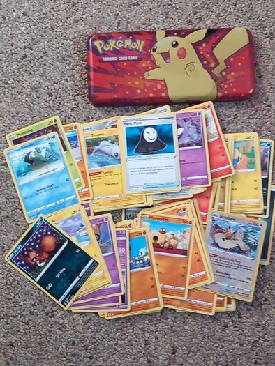 Pokemon tin and cards