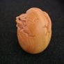 Carved wooden dragon hatching from an egg. Image 5