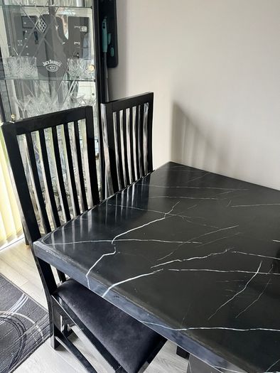 Table and chairs and glass cabinet