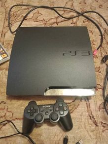 PS3 slim console, controller and games
