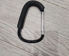Large D-shape carabiner-style stroller hook with a foam grip also known as a buggy clip, mummy clip, or pram hook