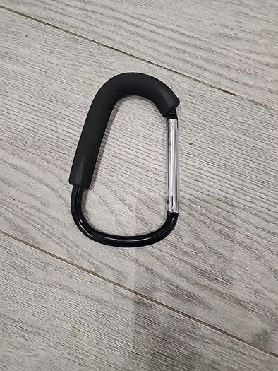Large D-shape carabiner-style stroller hook with a foam grip also known as a buggy clip, mummy clip, or pram hook