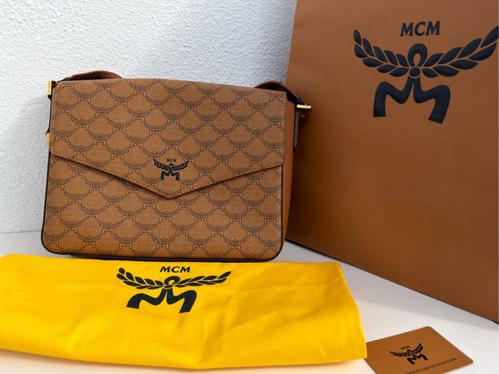 MCM Monogram messenger bag with natural nappa leather trim