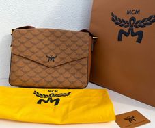 MCM Monogram messenger bag with natural nappa leather trim
