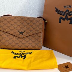 MCM Monogram messenger bag with natural nappa leather trim