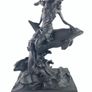 Girl sitting on a dolphin figurine Image 2