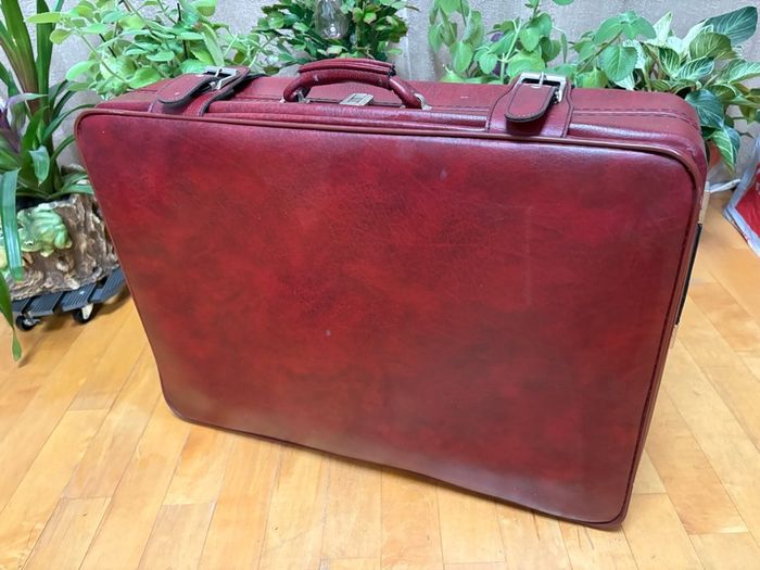Vintage burgundy faux-leather suitcase