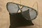 Aviator sunglasses with blue lenses and gold-tone arms