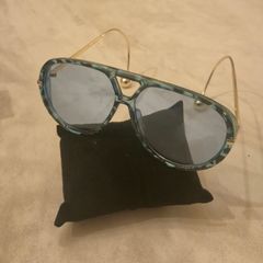 Aviator sunglasses with blue lenses and gold-tone arms