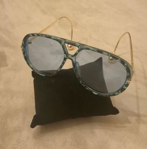 Aviator sunglasses with blue lenses and gold-tone arms