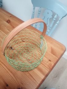 New wire woven basket with wooden handle
