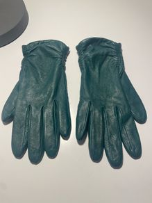 Fur-lined green leather gloves