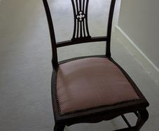 Antique style mahogany dining chair with pink upholstered seat