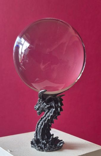 Crystal/glass ball and metal dragon stand.