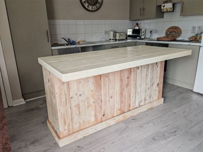 Rustic kitchen island with overhang