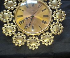 West German Acctim quartz Working Wall Clock featuring a gold-toned Starburst or Petal Design, Postage Available or Collection