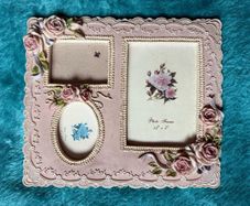 vintage-style pink resin multiple aperture photo frame with rose detailing.