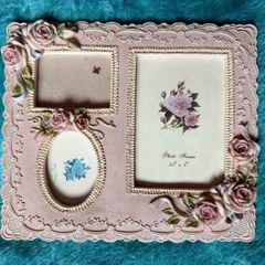 vintage-style pink resin multiple aperture photo frame with rose detailing.
