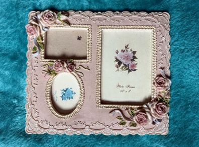 vintage-style pink resin multiple aperture photo frame with rose detailing.