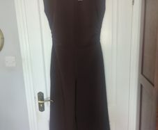 Boohoo jumpsuit Dark chocolate brown jumpsuit with gathered waist. Slight stretch in material.  Says sz 12 but small fitting.