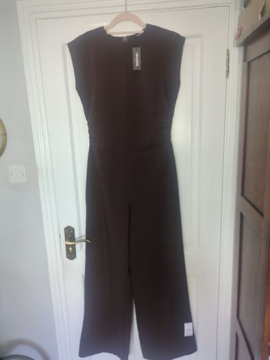 Boohoo jumpsuit Dark chocolate brown jumpsuit with gathered waist. Slight stretch in material.  Says sz 12 but small fitting.