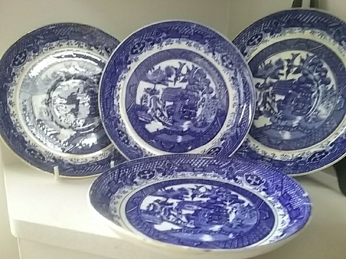 Four Blue Willow Saucers
