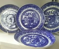 Four Blue Willow Saucers