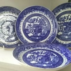 Four Blue Willow Saucers