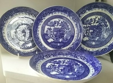 Four Blue Willow Saucers