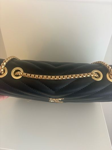 ladies black padded bag with gold coloured hardware. Brand new