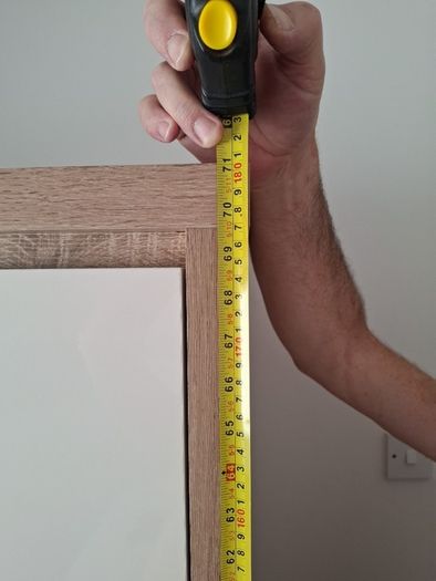 Timer and white wardrobe and bedside locker