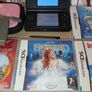 Nintendo ds lite in black with charger and games all in good working order Image 3