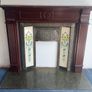 Traditional timber fireplace surround with cast iron insert, decorative tiled side panels and marble-effect hearth, all included. - Moate Image 2