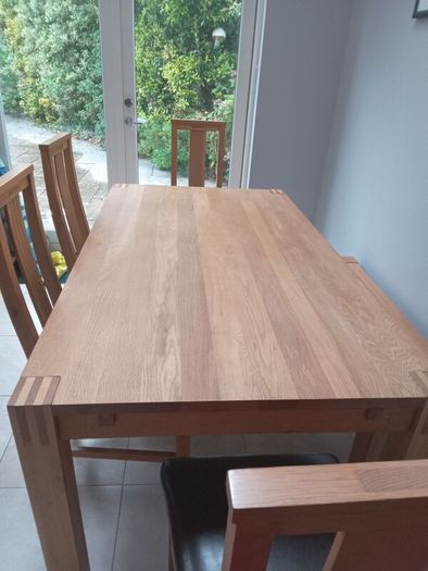 solid oak dining table and 4 chairs