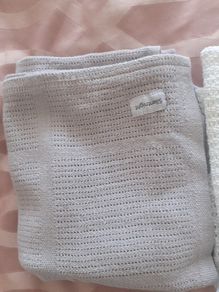 3 cellular baby blankets .Grey and white one are new  .One white one is slightly stained hence giving that one for free .