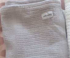 3 cellular baby blankets .Grey and white one are new  .One white one is slightly stained hence giving that one for free .