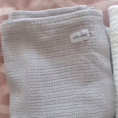 3 cellular baby blankets .Grey and white one are new  .One white one is slightly stained hence giving that one for free .