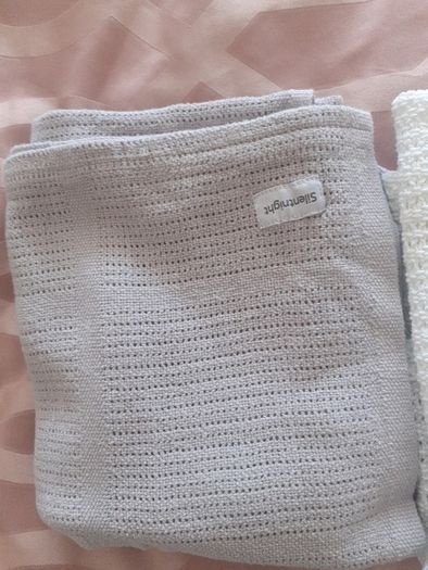 3 cellular baby blankets .Grey and white one are new  .One white one is slightly stained hence giving that one for free .