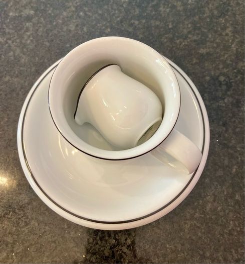 Coffee cup and cream jug