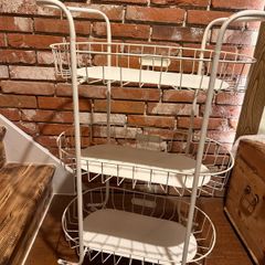 charming Iron shelf on wheels