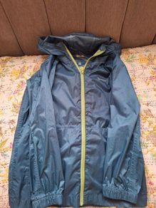 Green waterproof light mountain warehouse jacket 7-8 yrs