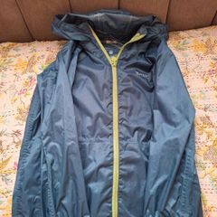 Green waterproof light mountain warehouse jacket 7-8 yrs
