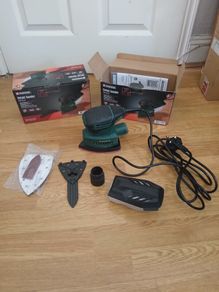 Detail sander with unopened spare sanding sheet pack as a bundle. 2 bundles available.