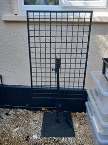 Large metal grid on stand