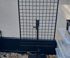 Large metal grid on stand